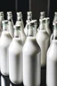 Placeholder: a lot of bottles of milk standing in a line