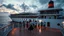 Placeholder: a group of young ladies and young men are dancing to camera on deck of a huge moder ship in oceion ,cloudy sun set sky