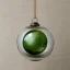 Placeholder: glass orb with stained glass effect, linen backdrop