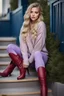 Placeholder: beautiful 18 year old girl with ash blonde hair and blue eyes with her curvy hair down, wearing a long-sleeved woollen top, and lilac long leggings, with long red boots full body shot