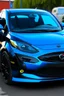 Placeholder: eine schwarze katze liegt auf einem blauen mazda 2 von 2016