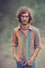 Placeholder: hippie young man with glasses of colours and poor and short short short and poor hair on the head with receding hairline. Farsightedness glasses with big eyes. Shirt beard in the head. Vintage look and feel like photo style-of the 70s