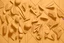 Placeholder: A light khaki wall with weird shapes