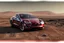Placeholder: A Tesla 'Model Y' is drifting at high speeds, at the Cydonia region on Mars. (CINEMATIC, WIDE ANGLE LENS, PHOTO REAL)