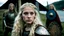 Placeholder: Photo is in sharp focus with high resolution. It is is a closeup portrait of a beautiful and slender caucasian 16 year old teen girl with long wavy platinum blonde hair. She has full lips, a turned up nose, arched eyebrows and large blue eyes. She is wearing viking shield maiden armor with in a Viking camp in Norway. Full daytime. She is gazing at the viewer.