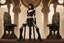 Placeholder: a skinny Cleopatra, with a bob hairstyle, in black boots, standing next to a black gothic seat, in a steampunk setting.