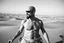 Placeholder: man looking like "Walter White" in breaking bad tv show, bald and goatee, with bare chest riding on a camel in sahara in desert, panorama, black and white photo, staring at a small town in horizon