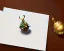 Placeholder: one acorn in tin box with note tied around