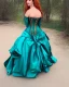 Placeholder: princess with long auburn hair in a big teal green and gold satin ballgown corset off shoulder top casting magic