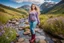 Placeholder: country side ,blue sky , mountains, pretty clouds ,small rocky river with clear water small rocks in floor,wild flowers,beautiful 18 year old girl with ash blonde hair and blue eyes with her curvy hair down, wearing a long-sleeved woollen top, and lilac long leggings, with long red boots full body standing pose shot