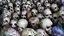 Placeholder: hundreds of anatomically correct, human skulls stacked into a wall unusual neon lighting, high octane, 64k, dystopian, vray, a picture of a dark, comedic, anatomically correct wall of colorful tightly packed skulls of varying sizes and expressions, photo-realistic, insanely meticulous, highly detailed,, 64k, dystopian, vray