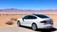 Placeholder: A Tesla's 'Model S Plaid' is parked, at the 'Lake Mead', in Nevada. CINEMATIC. WIDE ANGLE LENS.