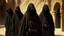 Placeholder: hooded monks in black robes in egypt