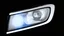 Placeholder: vehicle headlight(with chrome trim) on black background, add details and inner glow