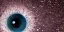 Placeholder: Extreme close-up of a human eye that contains a universe