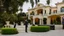 Placeholder: panoramic ,brass orchestra playing outside a beverly hills style mansion, exterior photography of a romantic and bright house, 8k, ultra HD