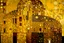 Placeholder: A yellow fortress with glowing halos painted by Gustav Klimt