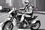 Placeholder: Cartoon man wearing corporate clothes nike He rides on his motorcycle wearing shoes nike Tn
