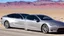 Placeholder: A Tesla's 'Model S Plaid' is racing at top speed, by the 'Lake Mead', in Nevada. CINEMATIC. WIDE ANGLE LENS.