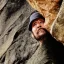 Placeholder: face of a man in a rock cliff