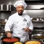 Placeholder: a bustling kitchen, filled with the clinking of pots and pans, the sizzle of ingredients hitting the hot pan, and the fragrant aromas wafting through the air. The Chef Ice-T from Law & Order: Special Victims Unit stands at the center of it all, a master of culinary creativity and precision. Today, the challenge is to highlight a specific ingredient in a way that is both creative and absolutely delicious. Ice-T's eyes light up with excitement as they reach for a vibrant, ripe meat. The bloody mea