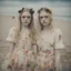 Placeholder: Elle fanning and dakota fanning as flowers, on the beach, damaged polaroid