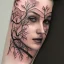 Placeholder: full face tattoo of branches and leaves that extend past face and become real, 8k resolution, high-quality, fine-detail, intricate, digital art, detailed matte, volumetric lighting, illustration, octane render,