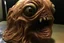 Placeholder: an eyeless, slimy, grotesque realistic parasite that looks like Donald Trump, horror
