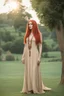 Placeholder: full body and headshot of a skinny Cleopatra, with long straight red hair, in a floaty dress, standing on a village green