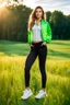 Placeholder: fullbody shot of young-beautiful-girl-with-a-perfect-face wearing sport pants and sport blouse and sport jacket and shoes standing in country side green field day lights