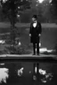 Placeholder: [vintage] A man in tuxedo around a pond