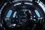 Placeholder: [movie shot by H.R. Giger in Verve colour palette] Cinematic side-profile of a pilot in a futuristic spaceship, slammed into his seat by extreme G-forces. Facial features strain under pressure. A round porthole beside him shows the dark void of space with faint star streaks. Cockpit illuminated by glowing panels and dramatic rim light, high-detail realism.