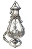 Placeholder: A sketch of a magical locket filigreed with silver in the shape of an hourglass made of bone