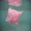 Placeholder: Pink plastic bag underwater in the 1970s, analog photography with white, damaged