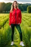 Placeholder: fullbody shot of young-beautiful-girl-with-a-perfect-face wearing sport pants and sport red blouse and sport jacket and shoes standing in country side green field day lights