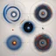 Placeholder: [art by Jean-Paul Riopelle] artistic and yet geometric representations of Bohr orbits: compares the electron probability densities for the hydrogen 1s, 2s, and 3s orbitals. Note that all three are spherically symmetrical. For the 2s and 3s orbitals, however (and for all other s orbitals as well), the electron probability density does not fall off smoothly with increasing r. Instead, a series of minima and maxima are observed in the radial probability plots