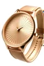 Placeholder: Create a realistic depiction of a retro ladies' wristwatch with a rose gold case, featuring a minimalist design, a slim leather strap, and a sunburst dial."