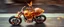 Placeholder: sparks blazing, seen from above, tattoo style, motion blur, airbrush art, transparent giger ant gremlin predator riding hands on an awesome roadster bike with wheels, spaceship in copper, fast one in the shape of a transparent snail , now its gonna do an awesome gig , bokeh like f/0.8, tilt-shift lens 8k, high detail, smooth render, down-light, unreal engine, prize winning