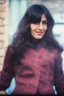 Placeholder: a woman standing in front of a brick wall, home video footage, persian rug, may 6 8, black bangs, waldo in the top right of frame, in a village street, of an beautiful girl, photo still of behind view, 1 female, old footage