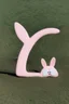 Placeholder: A pastel pink bunny shaped boomerang weapon.