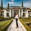 Placeholder: full body closeup shot of young lady in pants an blouse standing in garden of luxury villa posing to camera