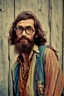 Placeholder: Hippie bohemian young ugly man with Parisian bohemian look and glasses of colours and poor and short short short and poor hair on the head with receding hairline. Farsightedness glasses with big eyes. Long beard. Vintage look and feel like photo styleof the 70s