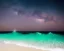 Placeholder: Night, stars, beach, calm, small waves, cool colors