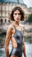 Placeholder: beautiful anorexic young woman, total shot, short shiny anthracite triathlon swimsuit, short brunette wavy bob hair, blurred city background