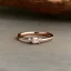 Placeholder: delicate thin ring with baguette diamond, knot, rose gold, thin ring