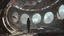 Placeholder: woman standing inside the interior of a ruined alien spaceship, with a circular window, overrun with mushrooms with jellyfish tentacles