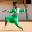 Placeholder: A surprised Niger sublime dancer woman, 24-years-old wearing a white and green one-piece swimsuit , she executes the crane movement of karate kid