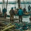 Placeholder: Fishermen hold their rods in a large port