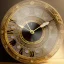 Placeholder: crystal ornate round clock with a transparent body, gold sand, transparent, rococo, Artstation, intricate detailed 8 k, ornate and jewels,