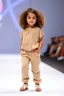 Placeholder: 2 years old baby girl fashion model in loose pants and loose top with curvy wavy hair ,cat walks in runway,catwalk and pose at end with cute